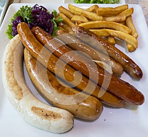 Grilled mix sausage with French fries.
