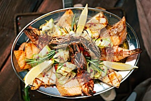Grilled Mixed Seafoods set in metal plate