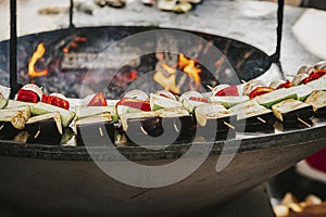 Grilled multicolored vegetables close up, zucchini, pepper on grill plate. Concept of summer picnic, backyard barbecue