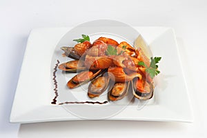 Grilled mussels on white