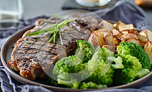 Grilled new york strip steak with rosemary and vegetables