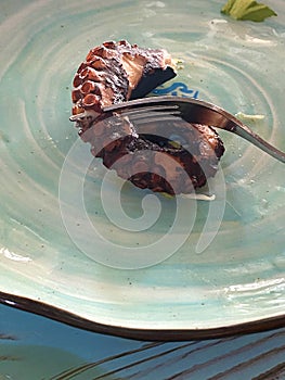 grilled octopus on a fork