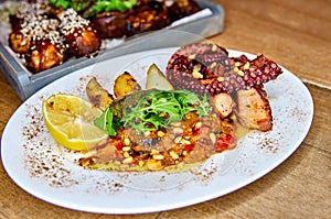 Grilled octopus with grilles potatoes and peppers, national cuisine, Madeira, Portugal