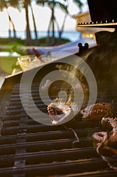 Grilled octopus during a Hawaiian sunset