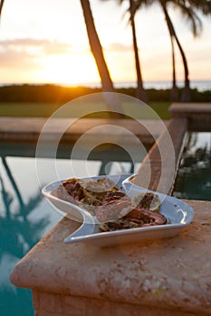 Grilled octopus during a Hawaiian sunset