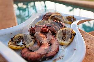 Grilled octopus during a Hawaiian sunset