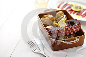 Grilled octopus with potatoes, polvo lagareiro, Portuguese cuisine photo