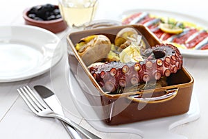 Grilled octopus with potatoes, polvo lagareiro, Portuguese cuisine photo