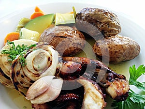 grilled octopus, potatoes and vegetables