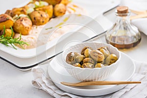 Grilled olives with whipped feta, ricotta, cheese dip (Tirokafteri) with crispy baked potatoes