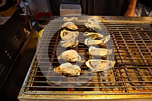 Grilled oysters as street food in Shanghai