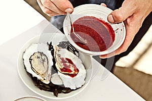 Grilled oysters with cranberry sauce