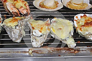 Exclusive grilled oysters and gambas with cheese, Asia photo