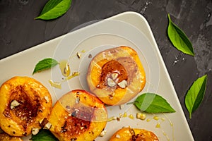 Grilled peaches on the rustic background