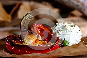 grilled peppers with ice cream on a wooden table. close up