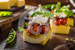 Grilled polenta with tomatoes