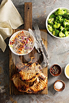 Grilled pork chops with cole slaw salad