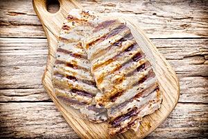 Grilled pork chops pieces. Spices and rosemary.