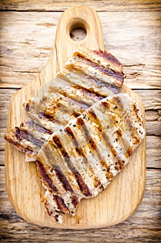 Grilled pork chops pieces. Spices and rosemary.