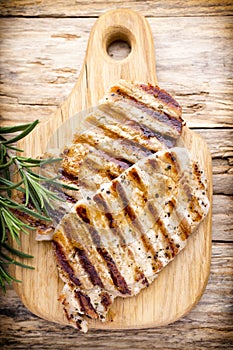 Grilled pork chops pieces. Spices and rosemary.