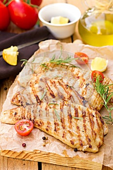 Grilled pork escalopes with rosemary and cherry tomatoes