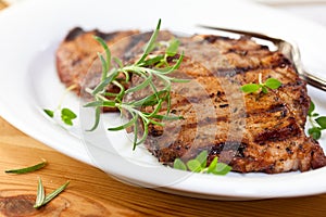 Grilled pork with fresh herbs photo