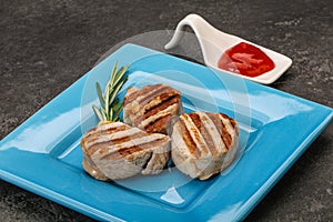 Grilled pork medallion with sauce