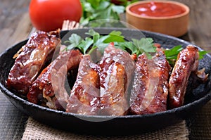 Grilled pork ribs in frying pan