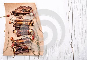 Grilled pork ribs with herbs top view