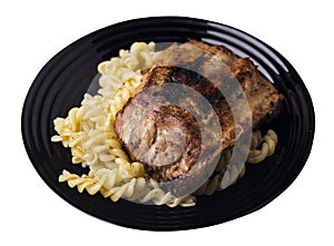 Grilled pork ribs with pasta. grilled pork ribs on a plate isolated on white background top view