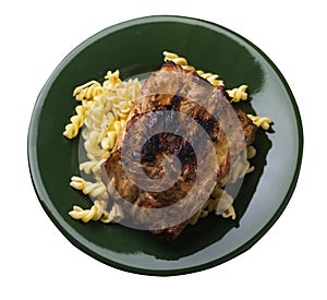 Grilled pork ribs with pasta. grilled pork ribs on a plate isolated on white background top view