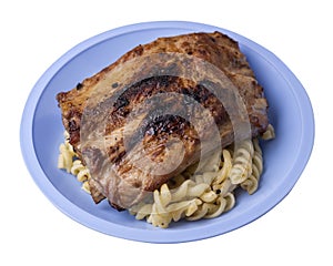 Grilled pork ribs with pasta. grilled pork ribs on a plate isolated on white background top view