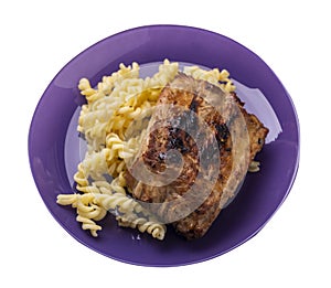 Grilled pork ribs with pasta. grilled pork ribs on a plate isolated on white background top view