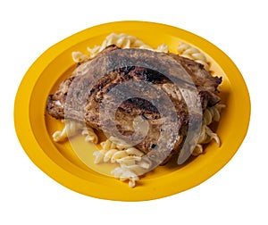 Grilled pork ribs with pasta. grilled pork ribs on a plate isolated on white background top view