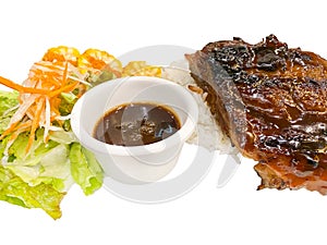 Grilled pork ribs with rice and fresh vegetables and corn on a white background