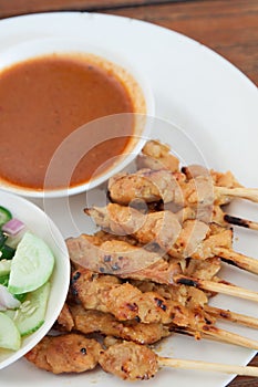 Grilled pork satay with peanut sauce and vinegar