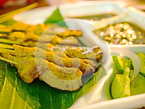 Grilled pork satay with peanut sauce and vinegar