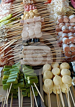 grilled pork satay with vegetables and spices