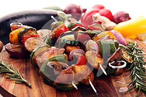 Grilled pork shish or kebab on skewers with vegetables . Food background shashlik