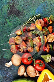 Grilled pork shish or kebab on skewers with vegetables . Food background shashlik