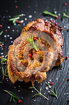 Grilled pork steak with herbs and spices