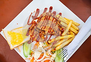 Grilled pork steak with salad on a plate