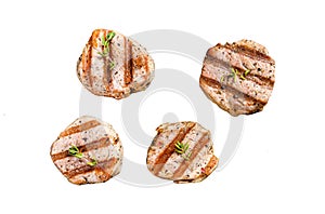 grilled pork steak tenderloin with fresh herbs. Isolated on white background. Top view.
