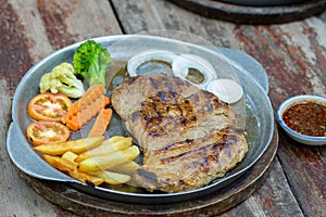 Grilled Pork Steaks and French Fries with Vegetable