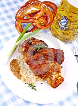 Grilled pork with whitish, sweet mustard, pretzels and beer photo