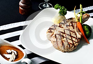 Grilled Porkchop Steak on the dining table