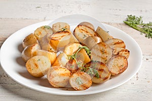 Grilled potato on a white table
