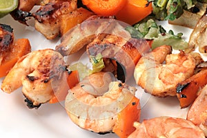 Grilled prawns on bamboo sticks