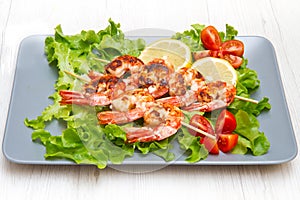 grilled prawns with salad and cherry tomatoes