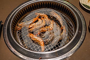 Grilled prawns and shrimps on flaming grill